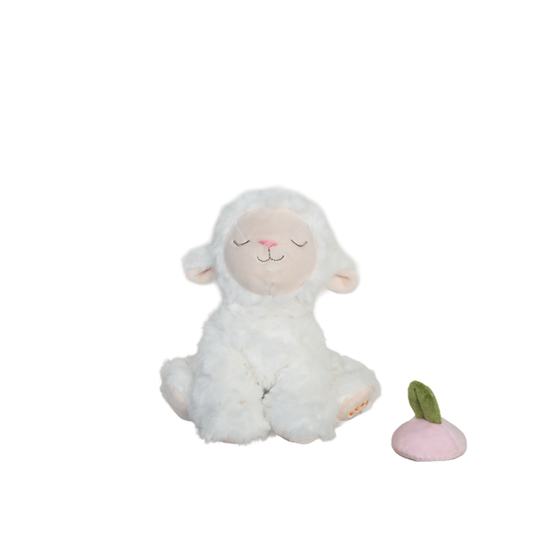 White plush lamb toy with a small pink apple on a white background