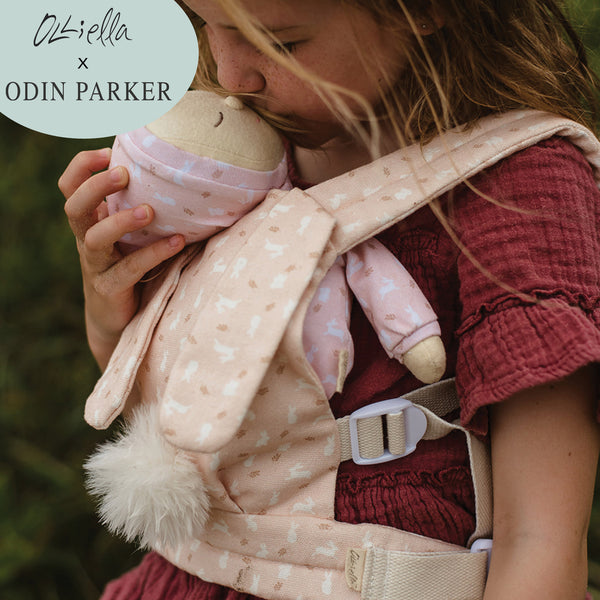 This soft, easter-themed pink doll carrier features adjustable straps and a snug fit, ideal for kids to tote their dolls comfortably. Perfect bunny-themed doll accessory, plush carrier for toddlers.