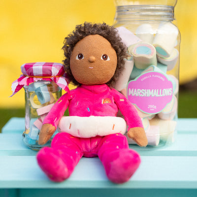 Limited-edition, palm sized, collectable kids plush toy. Sadie Sprinkles is a pink, strawberry donut weighted plush toy in a velvet onsie, perfect for imaginative kids play.