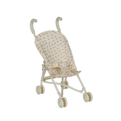 Miniature stroller with a patterned canopy on a white background
