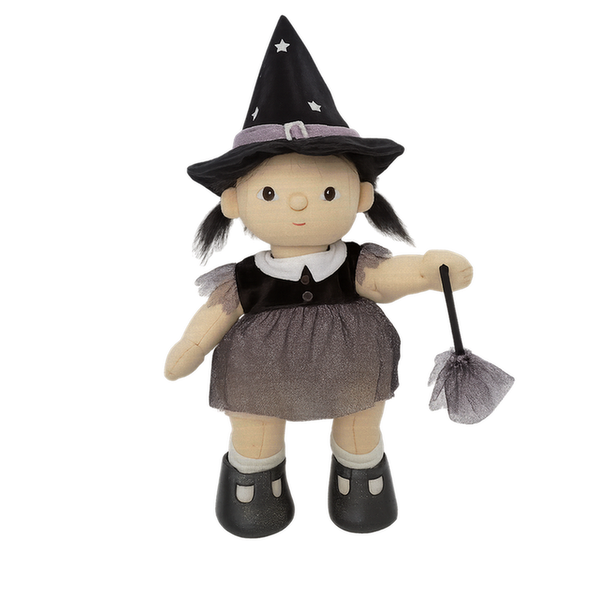 Toy doll dressed as a witch with a black hat, dress, and broomstick on a white background