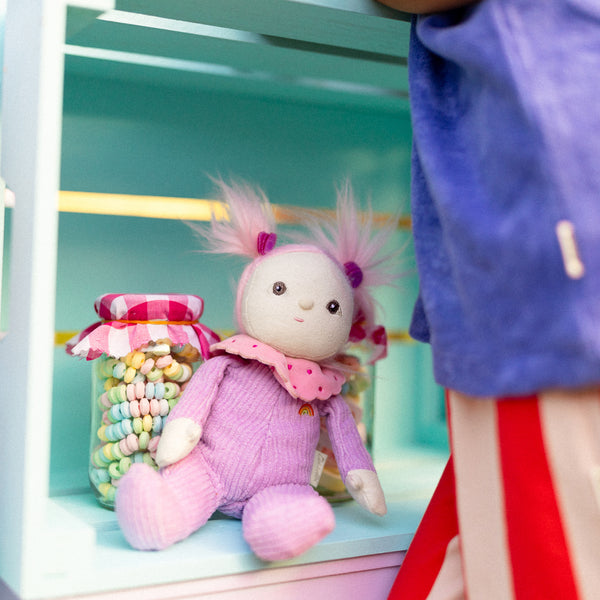 Limited-edition, palm sized, collectable corduroy kids plush toy. Clara Cupcake is a pink and purple weighted plush toy in a velvet onsie, perfect for imaginative kids play.