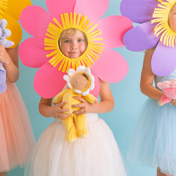 Charming Pip Buttercup Dozy Dinkums plush flower doll by Olli Ella. Ideal for imaginative play and comfort, crafted from durable, child-friendly fabrics.