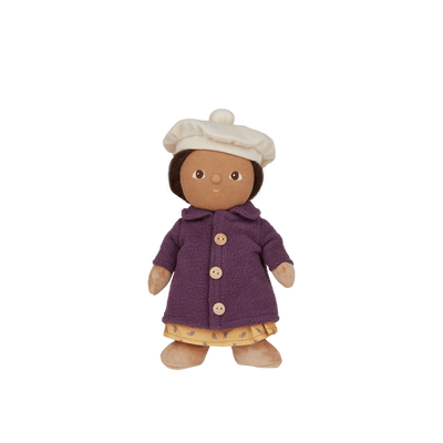 Toy doll with a purple coat and white hat on a white background