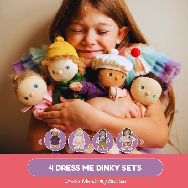Child holding four dress me dinky dolls with a pink banner at the bottom.