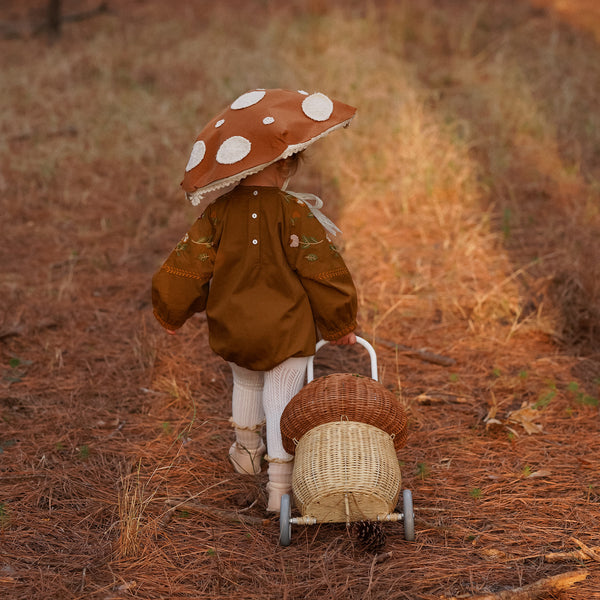 Whimsical natural mushroom basket on wheels. This 100% Handwoven Rattan wheeled basket is ideal for storing and toting around prized possessions!