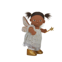 doll wearing white and gold fairy costume