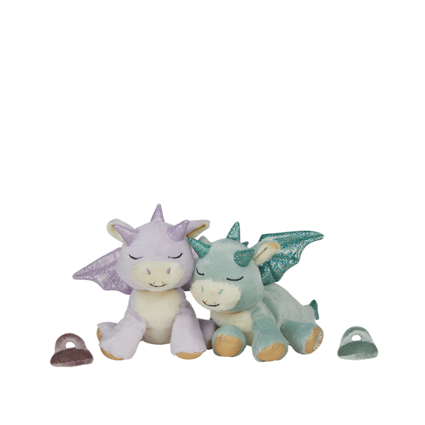 Two dragon-shaped plush toys on a white background