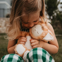 Little girl loves her ginger tabby cat, soft plush toy doll for kids
