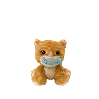 Plush toy cat with a blue fish on a white background