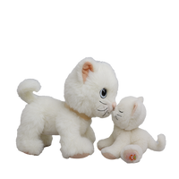 Two white plush cats on a white background