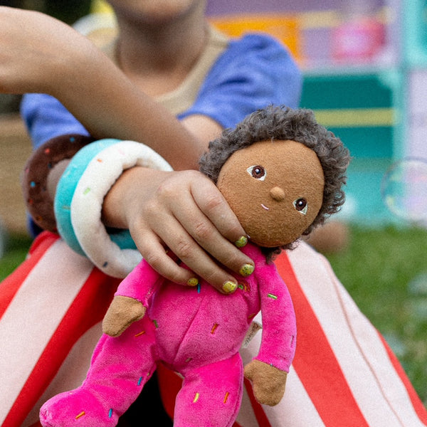 Sadie Sprinkles, our pink strawberry donut mini plush toy. Collectable, Soft and cuddly, and snuggled in a non-removable velvet onesie, Sadie Sprinkles is a must have in your toy collection.