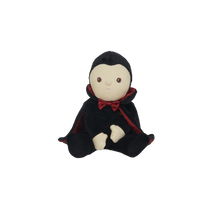 Stuffed toy with a black hood and red trim on a white background