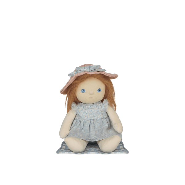 Stuffed doll with a pink hat and gray dress on a white background