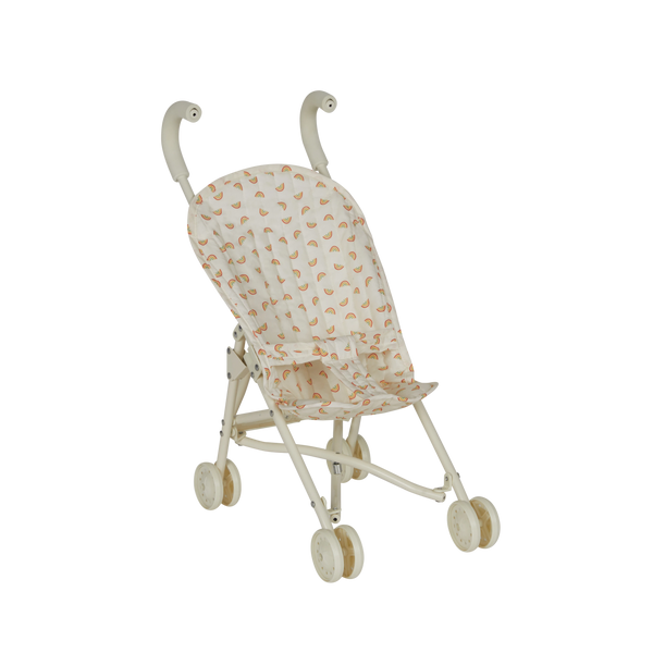 Miniature stroller with a patterned canopy on a white background