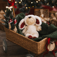 Olli Ella Christmas themed Cozy Dinkum Bunny with red features and Rattan Wagon