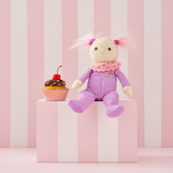 Limited-edition, palm sized, collectable corduroy kids plush toy. Clara Cupcake is a pink and purple weighted plush toy in a velvet onsie, perfect for imaginative kids play.