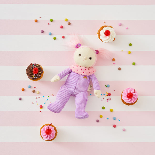Limited-edition, palm sized, collectable corduroy kids plush toy. Clara Cupcake is a pink and purple weighted plush toy in a velvet onsie, perfect for imaginative kids play.