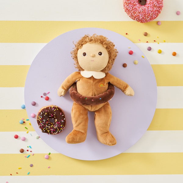 Limited-edition, palm sized, collectable kids plush toy. Darcy Donut is a chocolate donut weighted plush toy in a velvet onsie, perfect for imaginative kids play.