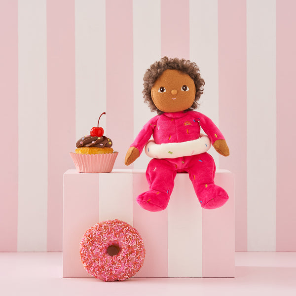 Sadie Sprinkles, our pink strawberry donut mini plush toy. Collectable, Soft and cuddly, and snuggled in a non-removable velvet onesie, Sadie Sprinkles is a must have in your toy collection.