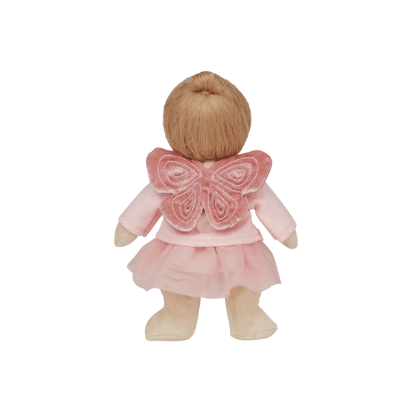 Doll with pink outfit and butterfly wings on a white background