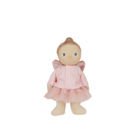 Standing toy doll in a pink outfit 