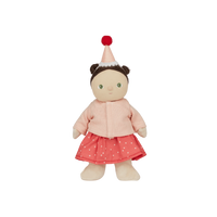 Stuffed doll with a pink outfit and red hat on a white background