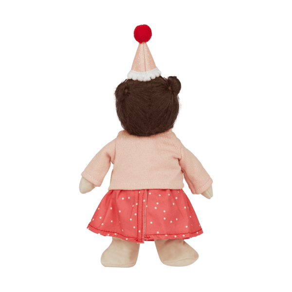 back of doll with hat, pink cardigan and spot dress