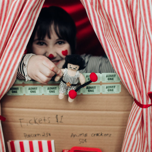 Olli Ella circus themed Holdie folk. Pocket-sized magical circus strongman plush toy for kids imaginative play.