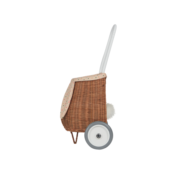 Woven rattan basket on wheels with printed lining. Perfectly sized for your kid to transport their favourite toys, dolls and treasures on their adventures. 