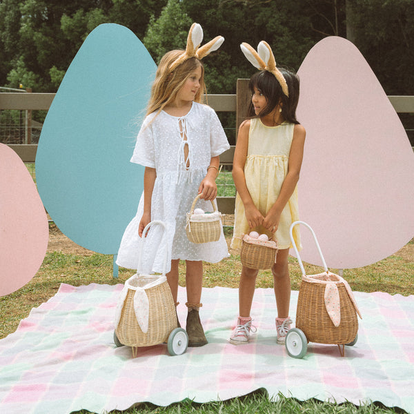 Rattan wheely basket with printed flower lining. Easter themed basket on wheels for kids to transport or store their favourite toys and treasures.