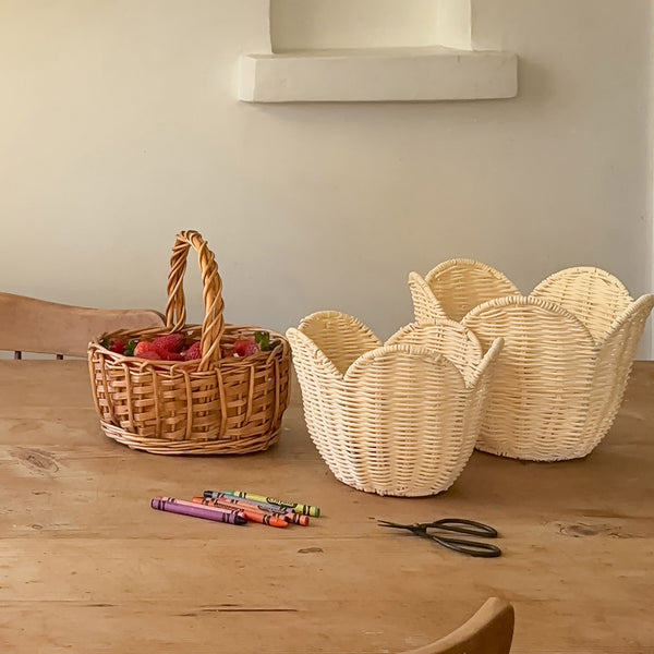 Set of off-white rattan baskets. Beautiful nesting baskets perfect for every nursery or play space, use as storage for dolls, toys or baby essentials.