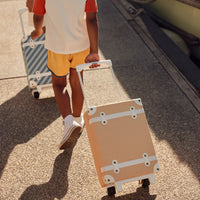 Stylish kids travel suitcase in yellow. Perfect for kids' travel, featuring a durable, lightweight build and eco-friendly materials. Made from recycled plastic bottles.