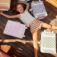 Charming pink kids travel suitcase by Olli Ella. Ideal for children's travel, with a spacious interior and playful colours. Constructed from recycled plastic bottles