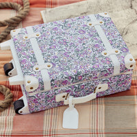 Charming Wildflower kids travel suitcase by Olli Ella. Ideal for children's travel, with a spacious interior and playful floral pattern. Constructed from recycled plastic bottles