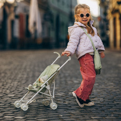 Olli Ella sage green doll pram for kids toys. Play with our posable dinkum dolls and teddies for kids doll play.