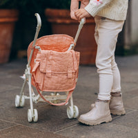 Olli Ella rose pink doll pram for kids toys. Play with our posable dinkum dolls and teddies for kids doll play.