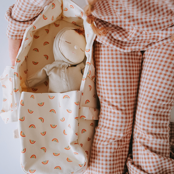 Rainbow printed fabric carry cot for kids toys and dolls. Spark imaginative kids play with this doll carry cot.