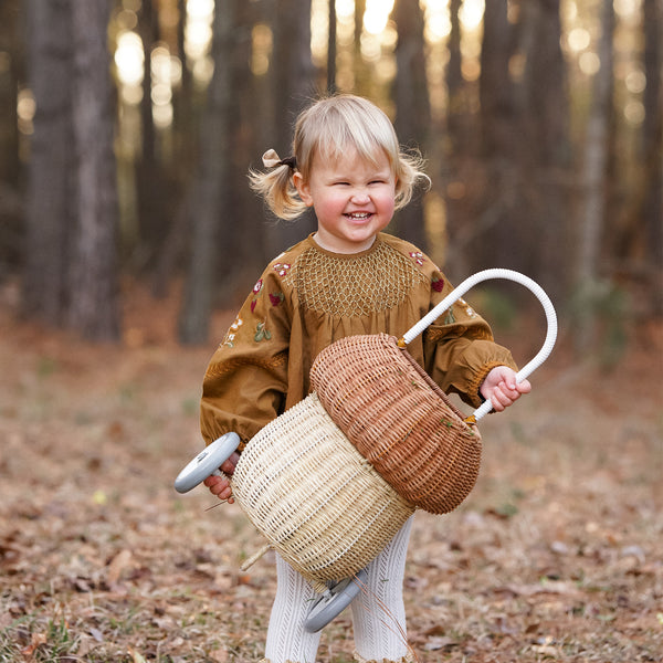 100% handwoven mushroom basket on wheels. This basket maked a beautiful addition to any woodland-themed nursery or bedroom or for transporting dolls, toys and trinkets.