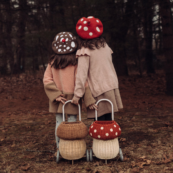 Whimsical red and white mushroom basket on wheels. This 100% Handwoven Rattan wheeled basket is ideal for storing and toting around prized possessions! 